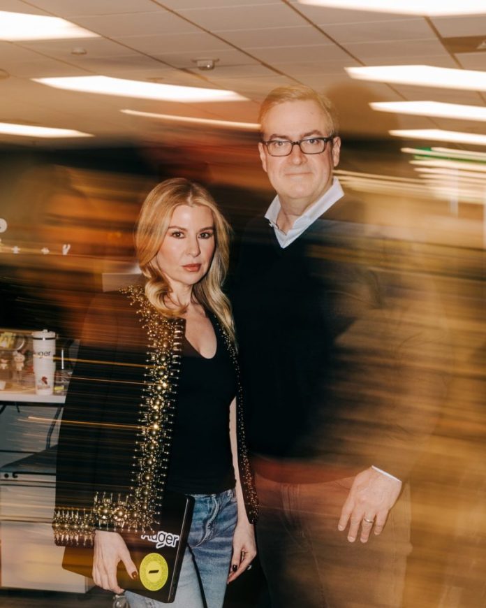 For at least two decades, former Amazon executive Dave Clark ended his work week the same way: a standing Friday date night with his wife, Leigh Anne.
Over dinner, the Clarks would talk through the “peak and pit” of their weeks. The ritual often revolved around Amazon, where Clark played a central role in building the logistics infrastructure that helped launch the e-commerce era.
During those years, Leigh Anne was a sounding board for her husband. In the process, she had a front-row seat to Amazon’s growth from what she called “a baby to a behemoth.”
By the time Clark left Amazon in 2022, he was CEO of the Worldwide Consumer division and one of billionaire founder Jeff Bezos’ top lieutenants.
Dave Clark at Auger headquarters Monday.David Jaewon Oh for NBC News
But these days, Fridays for the Clarks look very different.
Their dinner date has morphed into afternoon cocktails — a bourbon with Diet Coke for her and a Manhattan for him. And the conversation isn’t focused on Amazon anymore. It’s about Auger, the supply-chain startup they run together.
In their first joint interview from Auger’s Seattle office, the Clarks described how their marriage and complementary skill sets are shaping the company.
“We’ve been together for so long that we kind of just read each other’s minds,” Leigh Anne said. Working together, she said, “felt like a natural fit.”
This post appeared first on NBC NEWS